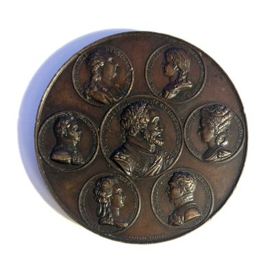 a picture of a bronze medal with a group of people on it