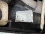 a close up of a car engine with a label on it