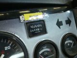 a close up of a car dashboard with various gauges