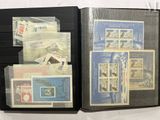 a lot of stamps in a folder on the table