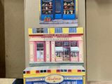 a cardboard model of a toy store on a table