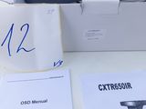 a box with a camera and manuals on the table