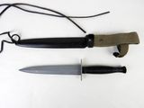 two knives that are laying next to each other on a table