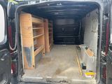 the back of a van with shelves in the back of it