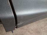 a close up of a car ' s bumper with a hole in it