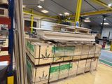 a large stack of boxes in a warehouse filled with wood