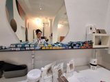 a woman that is taking a picture of herself in the mirror