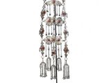 an image of a silver and red necklace on a black stand
