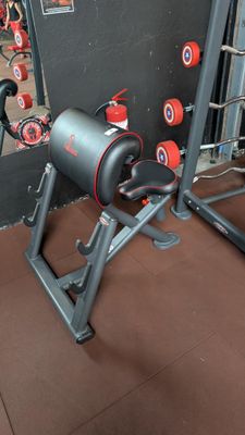 a gym equipment set up in the corner of a room