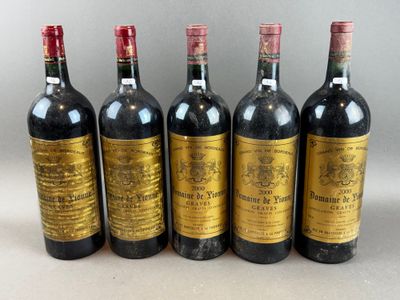 six bottles of wine lined up in a row on a table
