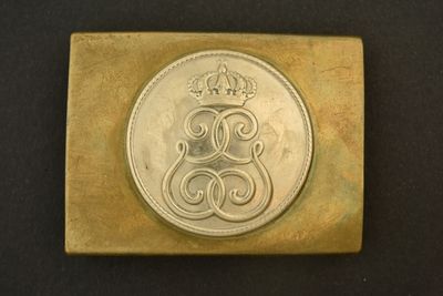an image of a metal stamp with a crown on it