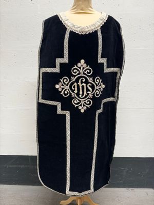 an image of a black and white robe on a mannequin stand