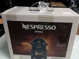 a box of nespresso coffee machine on a table