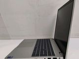 an open laptop computer sitting on top of a white table