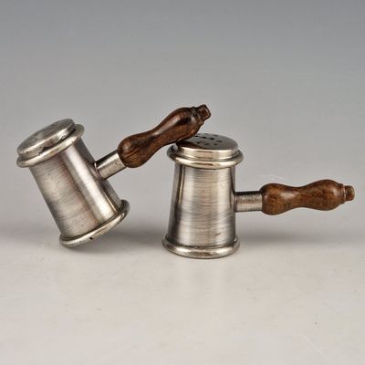 pair of antique pewware salt and pepper shakers with wooden handles