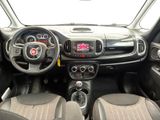 the interior of a small car with a steering wheel and dashboard controls
