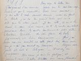 an old piece of paper with writing on it sitting on top of a table