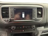 a picture of a car dashboard with a cell phone in the center