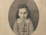 portrait of a young girl in a sweater and a collared shirt