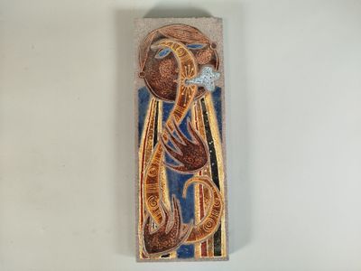 painting of a woman holding a cross on a wall