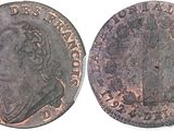 a close up of a coin with a crown on it