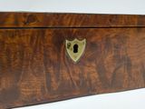 a wooden box that has a lock on it