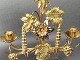 pair of antique brass candelabs with grapes and leaves