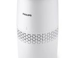 un purificateur d'air blanc posé sur une table blanche