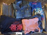 a lot of clothes that are sitting on the floor