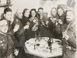 a group of people that are holding glasses of wine