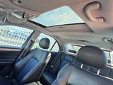 the interior of a car with black leather seats and a sunroof