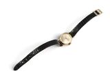 an image of a watch on a white surface with a white background