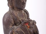 a statue of a woman holding a baby in her arms
