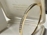 an image of a diamond ring in a box on a table