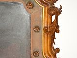 a mirror that is hanging on the wall in the room