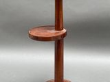 a close up of a wooden table with two shelves on it