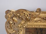 a gold frame with a picture of a woman ' s face on it