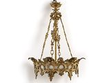 an antique brass chandelier hanging from the ceiling