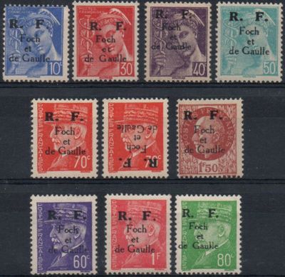 a close up of a group of stamps on a black surface