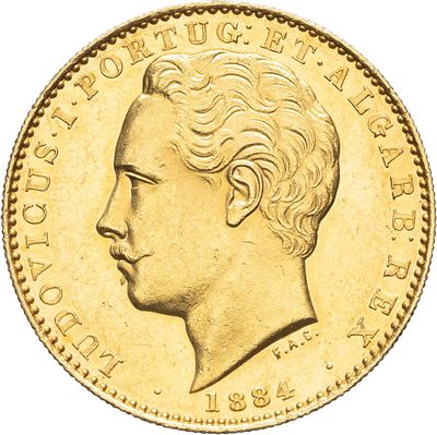 gros plan d'une pièce d'or sur laquelle figure le visage d'un homme