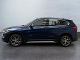 the bmw x1 is parked in a parking lot