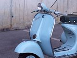 a scooter that is parked in a parking lot