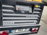 a close up of the back end of a truck in a garage
