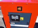 a red box that is sitting in the middle of a parking lot