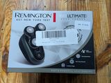 the box of the remington ultimate shaver is open on a wooden table