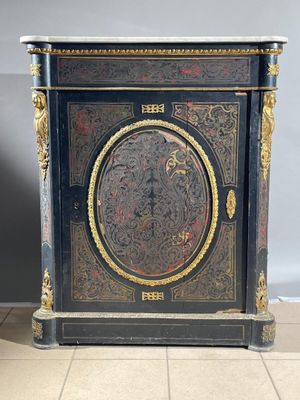a black and gold cabinet with a clock on it