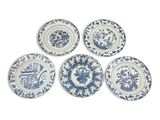 six blue and white plates with flowers on them on a white surface