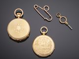 two gold pocket watches and a key on a black surface