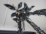 a close up of a bike with a bunch of leaves on the handlebars