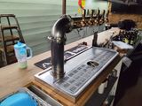 an image of a bar with a sink and a beer tap